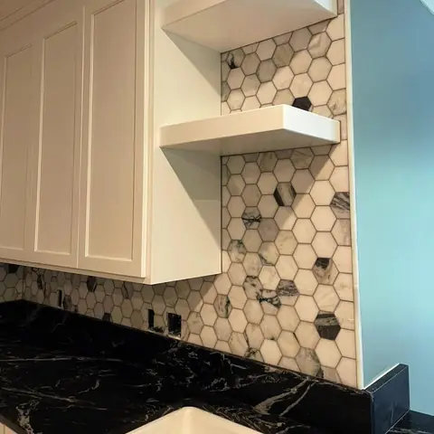 Hexagon tile backsplash with floating shelves