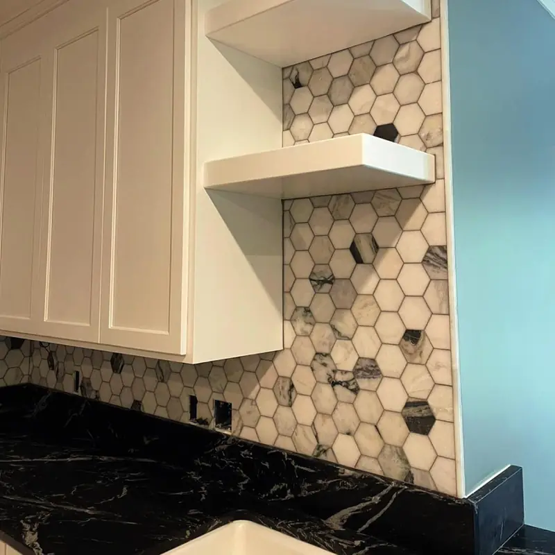 Hexagon tile backsplash with floating shelves
