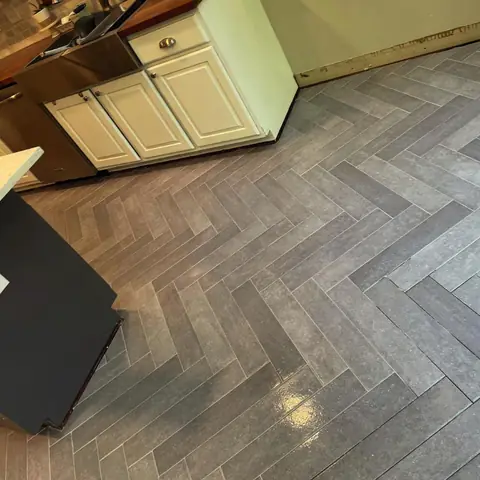 Gray herringbone tile floor