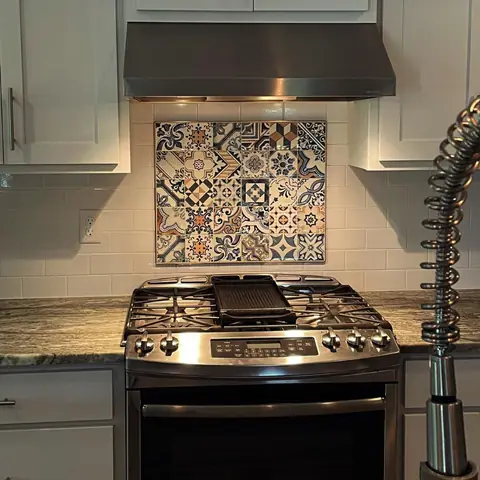 Patterned tile panel behind a gas range
